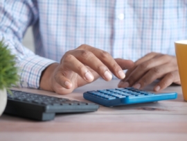 An accountant using a calculator.
